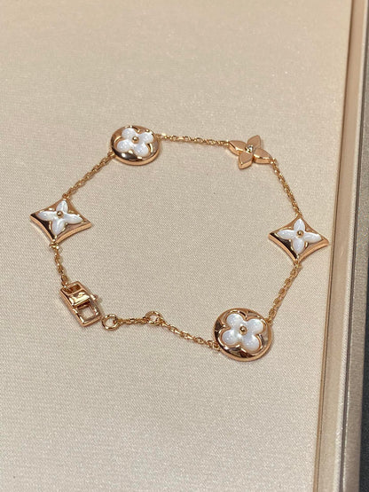 [Elitejewels]STAR AND SUN 5 MOTIF MOP PINK GOLD BRACELET